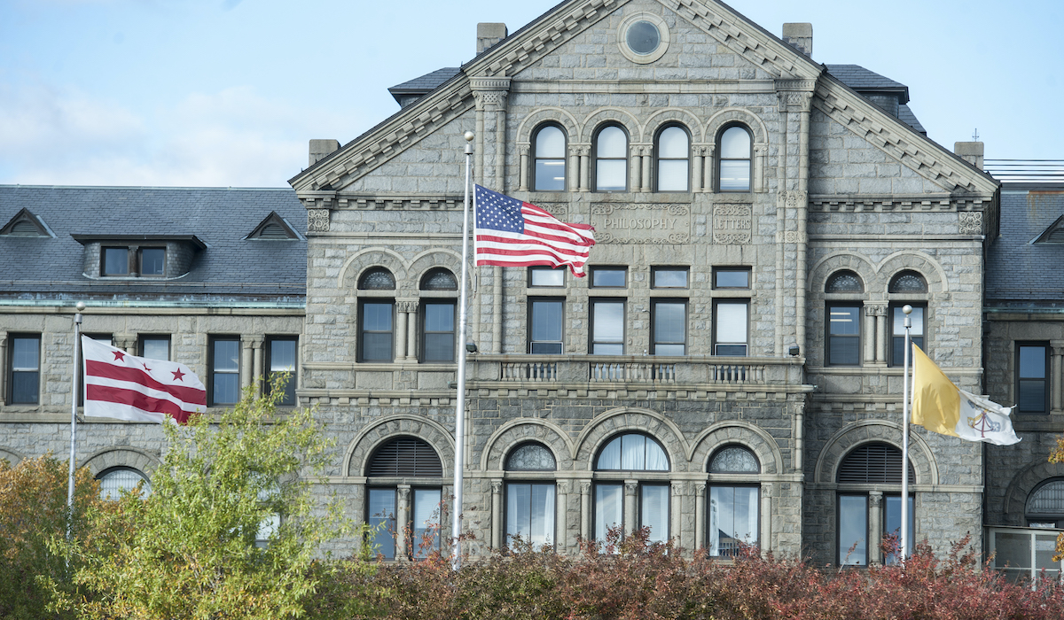 American flag waving outside McMahon Hall